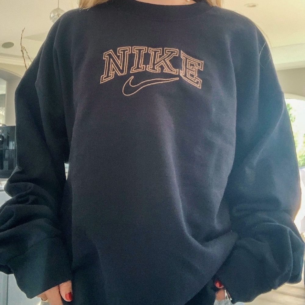 Black crewneck with brown "Nike" design
